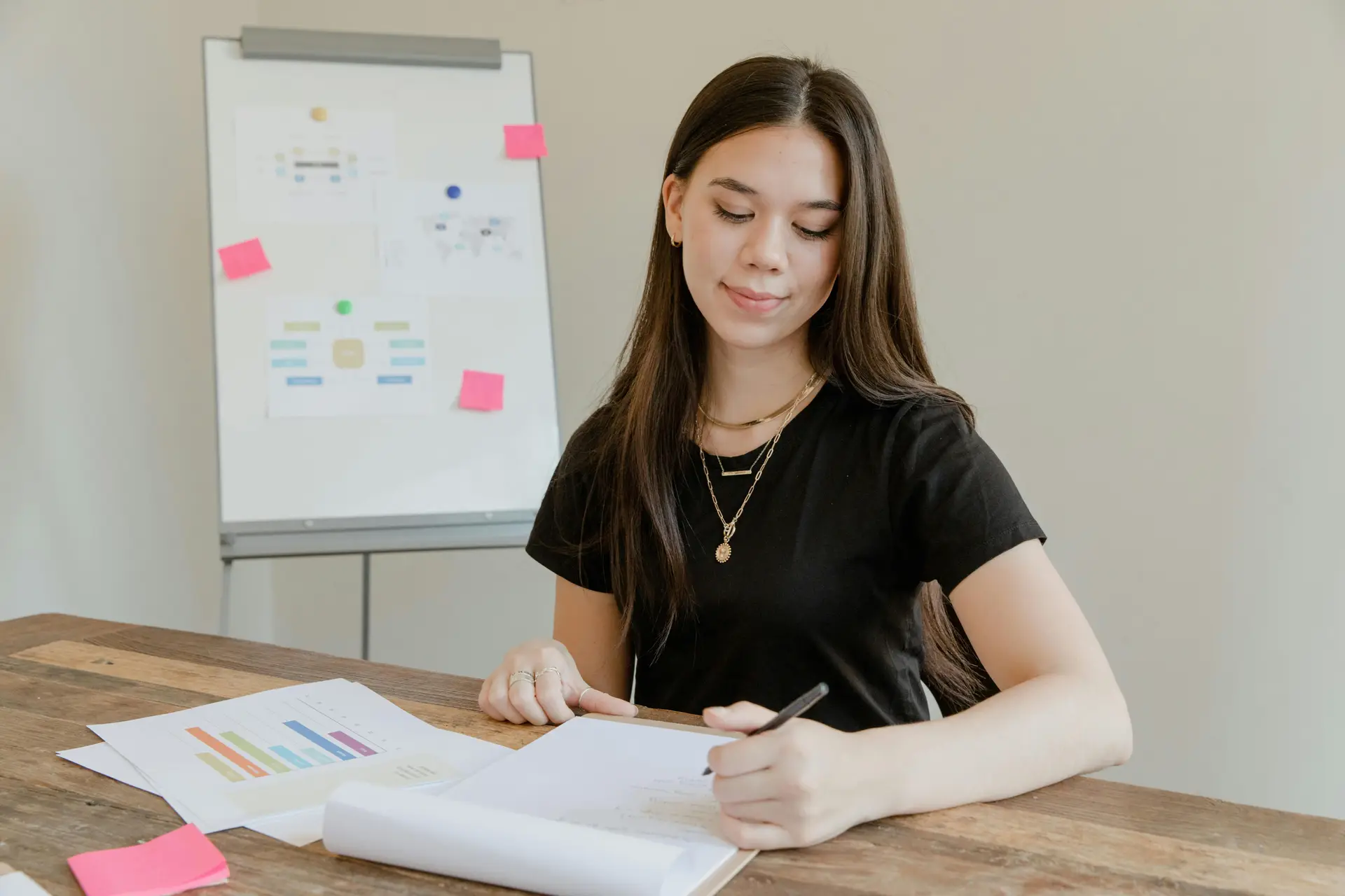 Woman writing with her left hand.