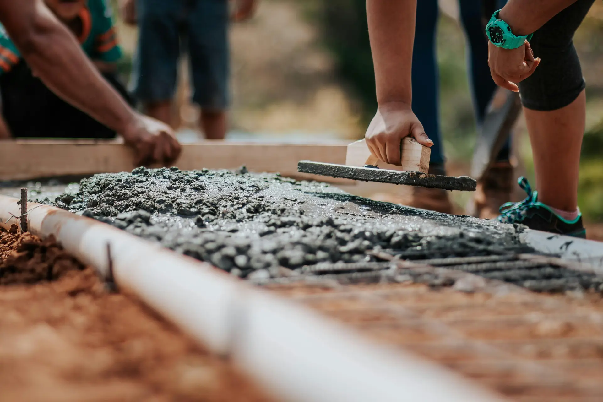 Workers working with cement.