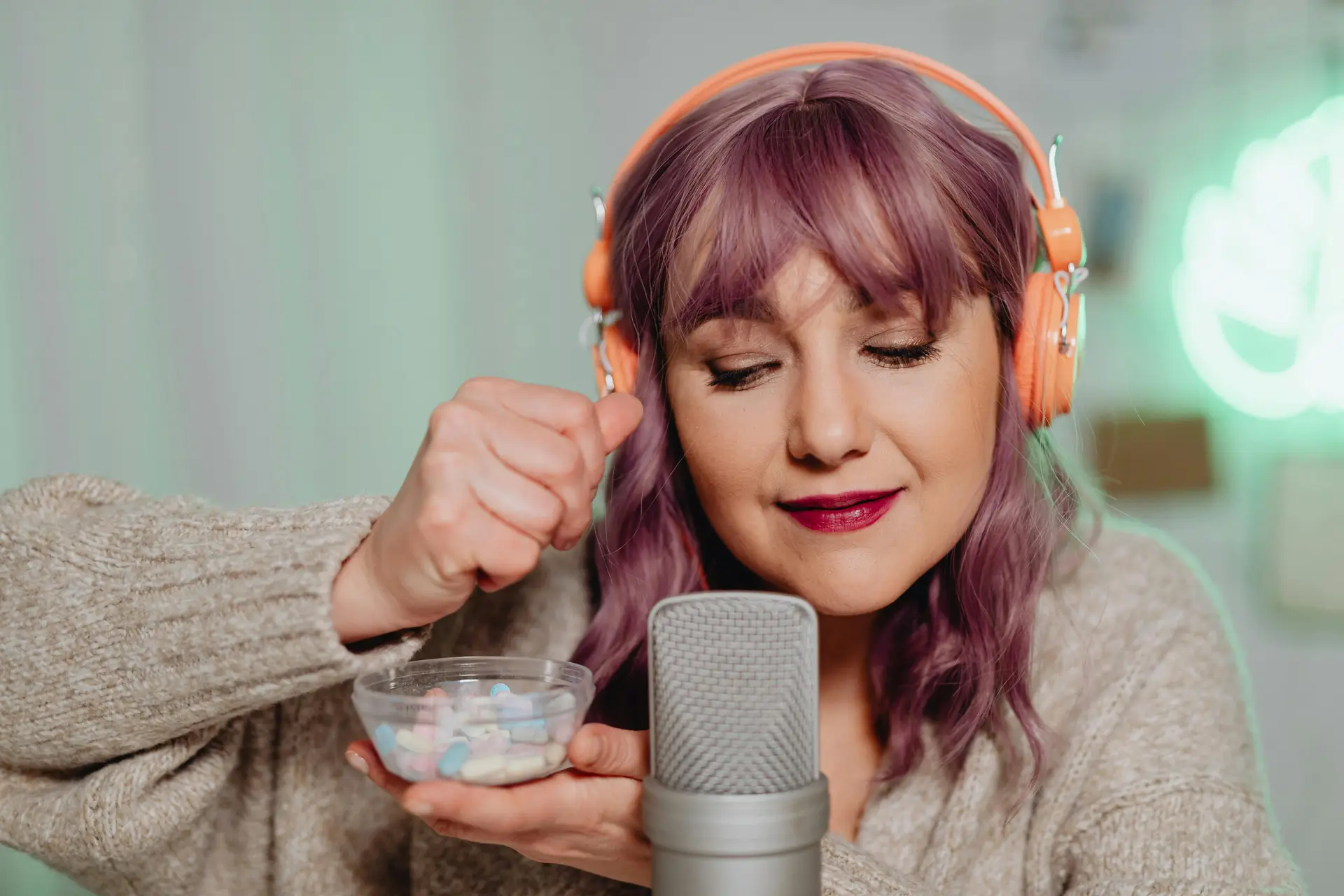 A Woman Recording an ASMR Audio Using Medicines