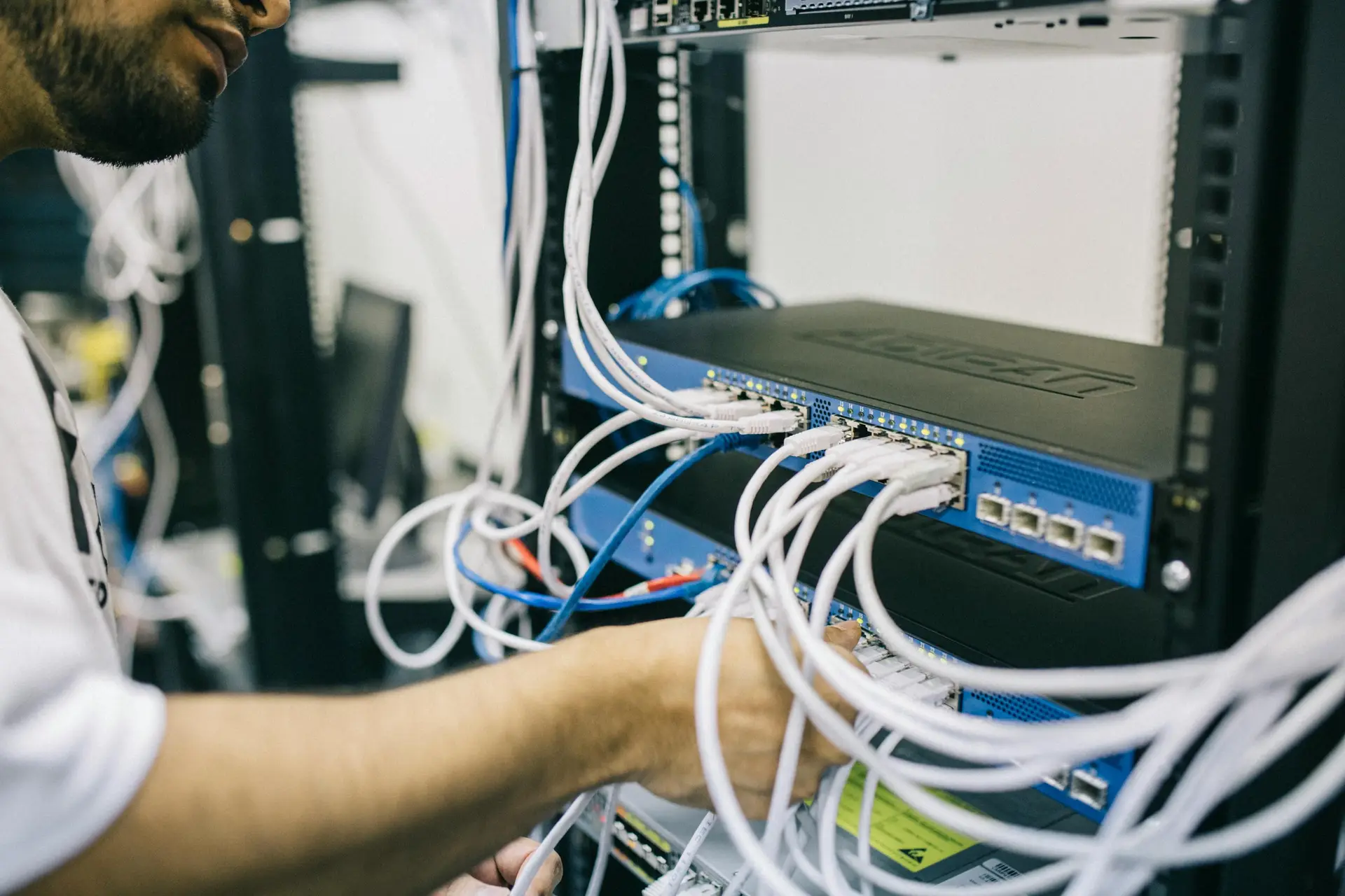 An IT professional fixing a server.