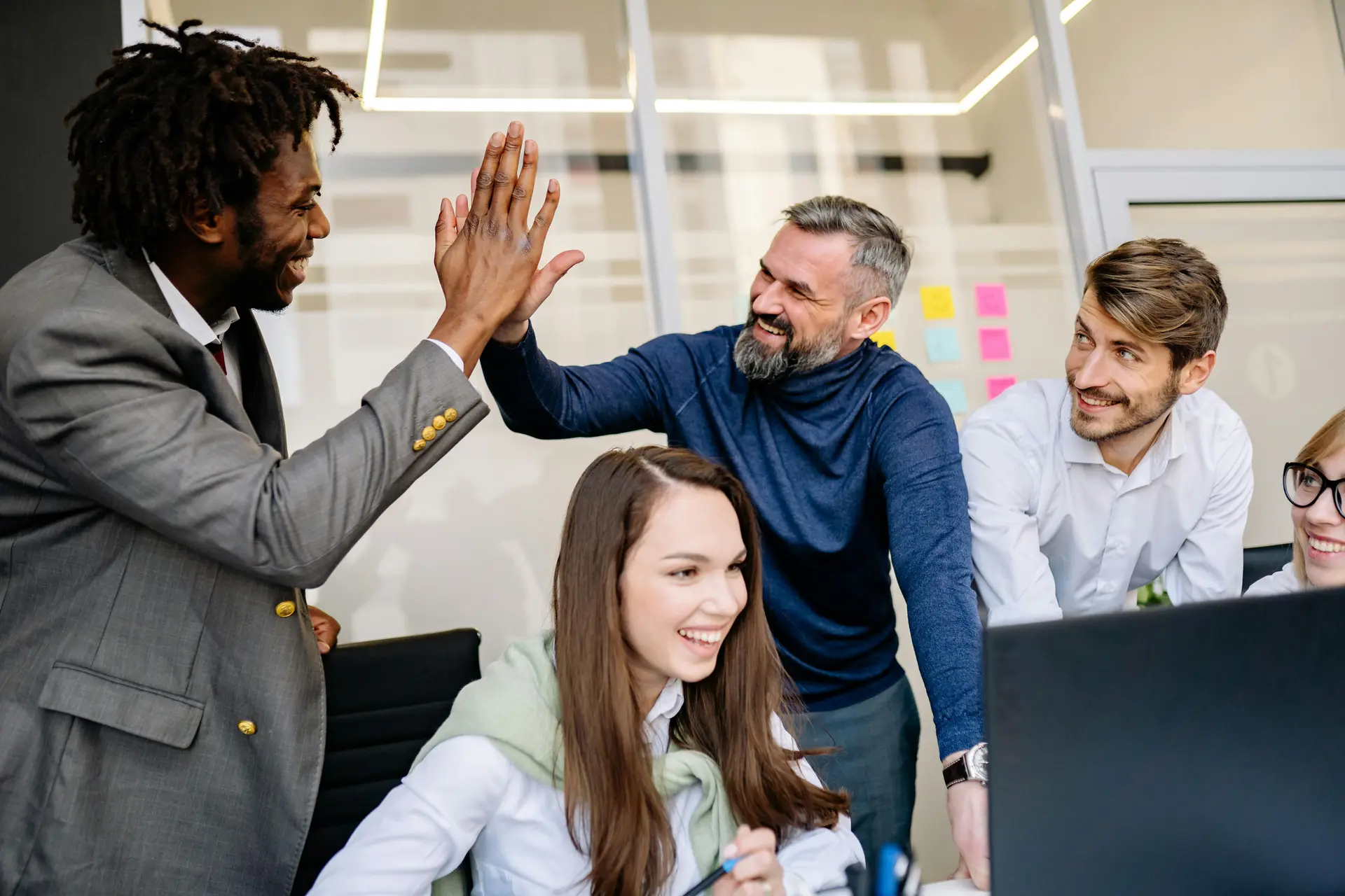 Men Doing High Five at the Office.