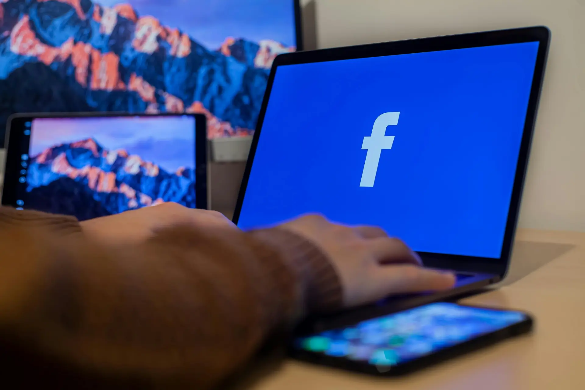 A person accessing Facebook from their laptop
