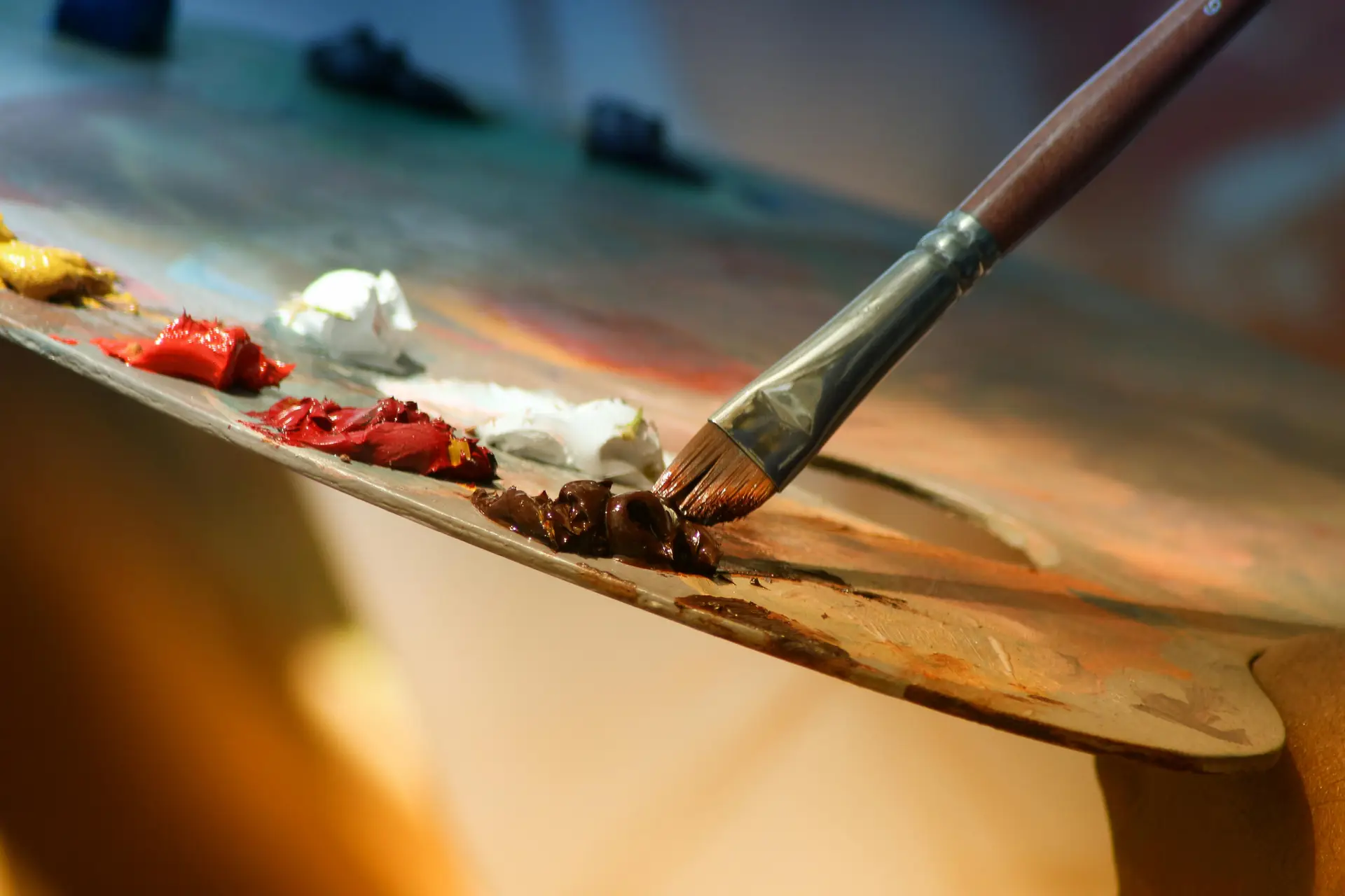 Someone drawing with a paintbrush and paint.