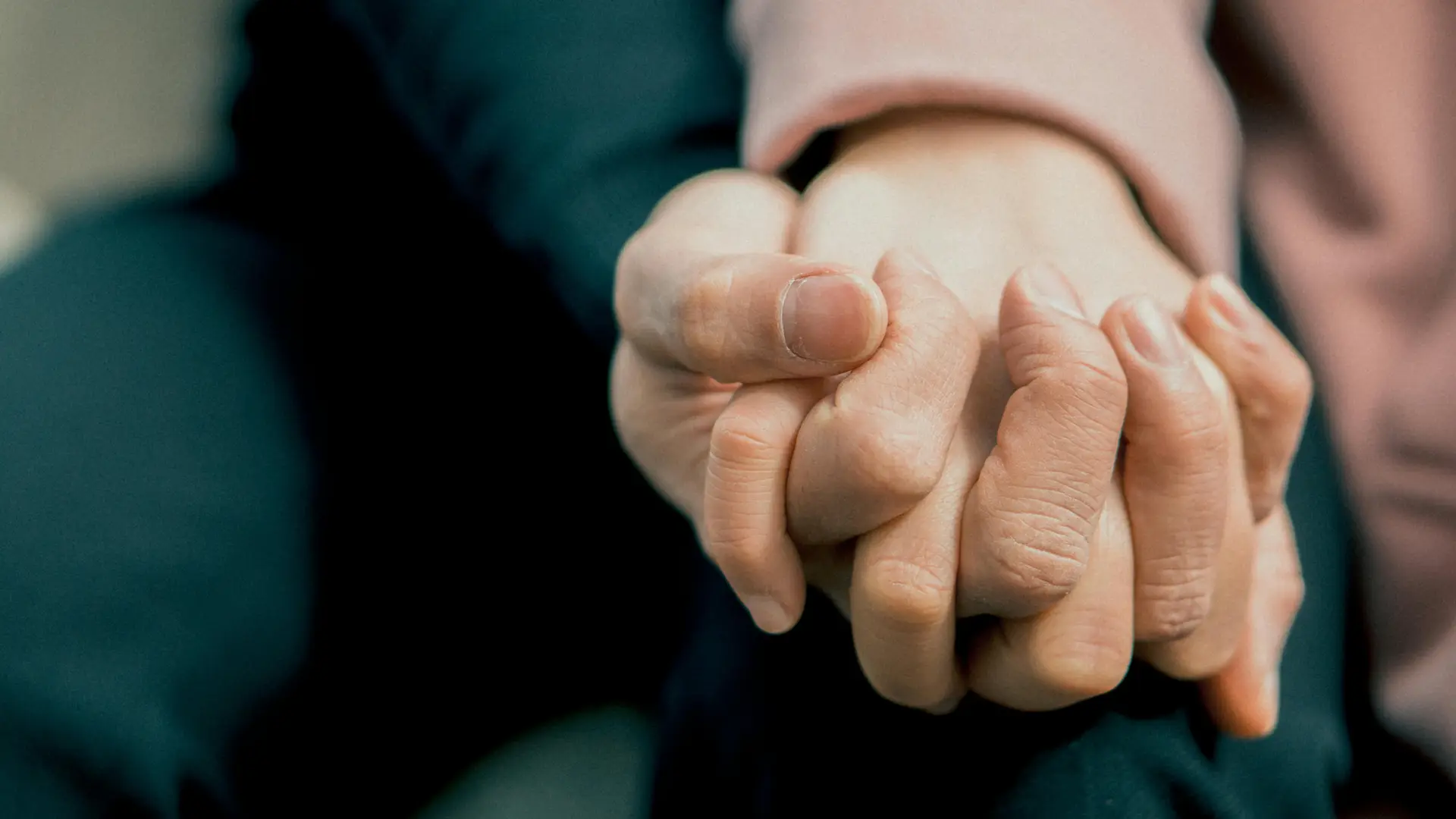 Two adult's holding hand on Promise Day