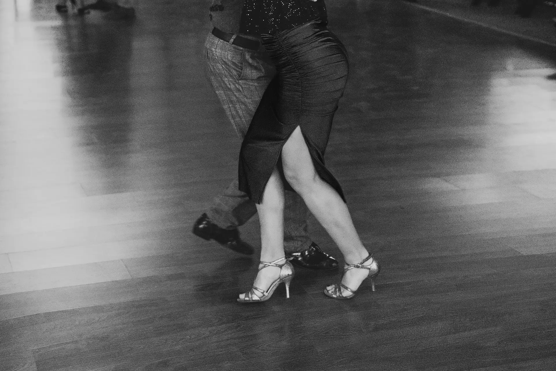 Two people tap dancing with each other.