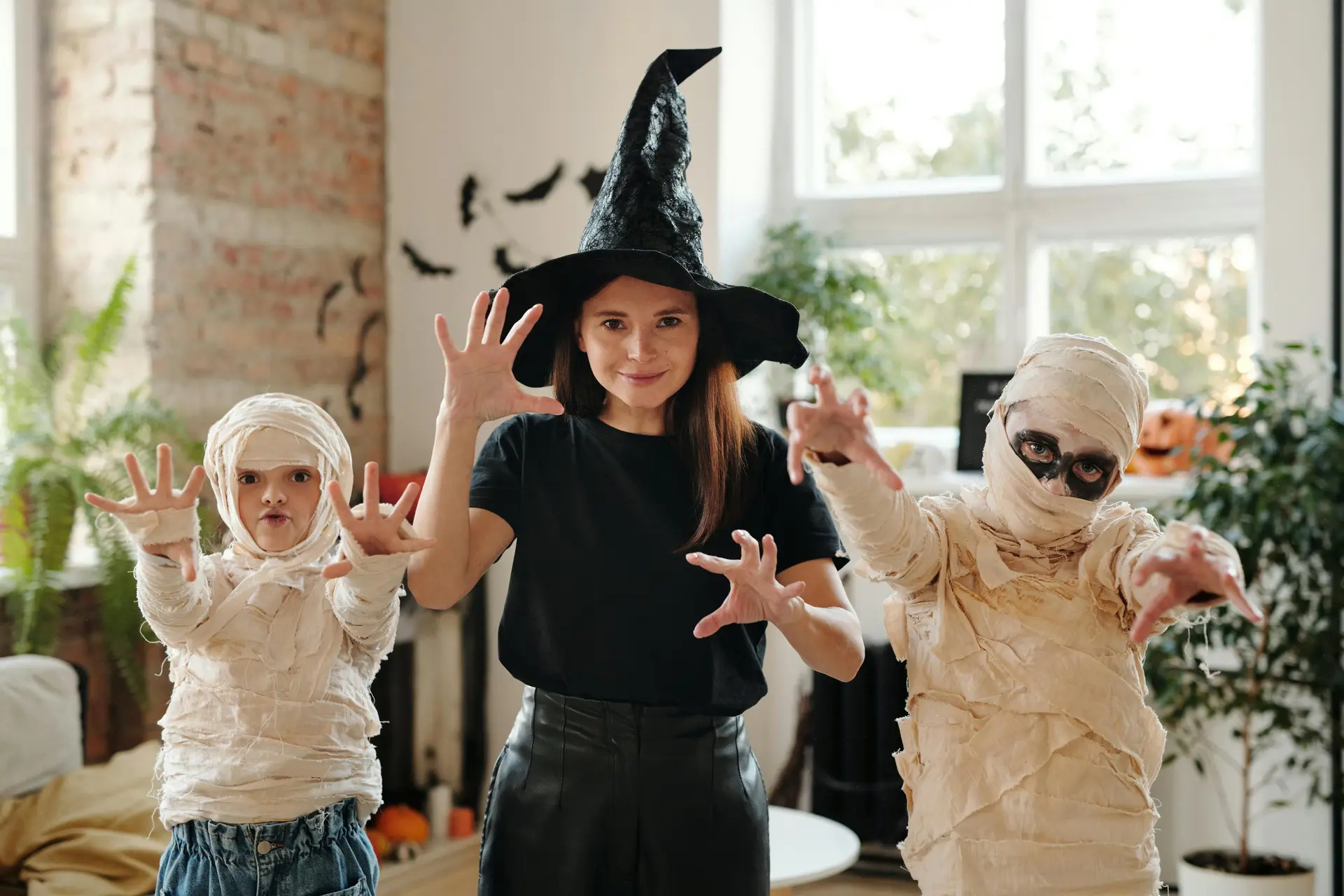 Children in Halloween costumes celebrating