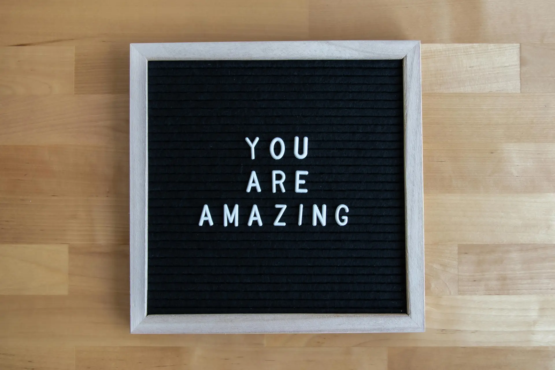 You are amazing written on a board.