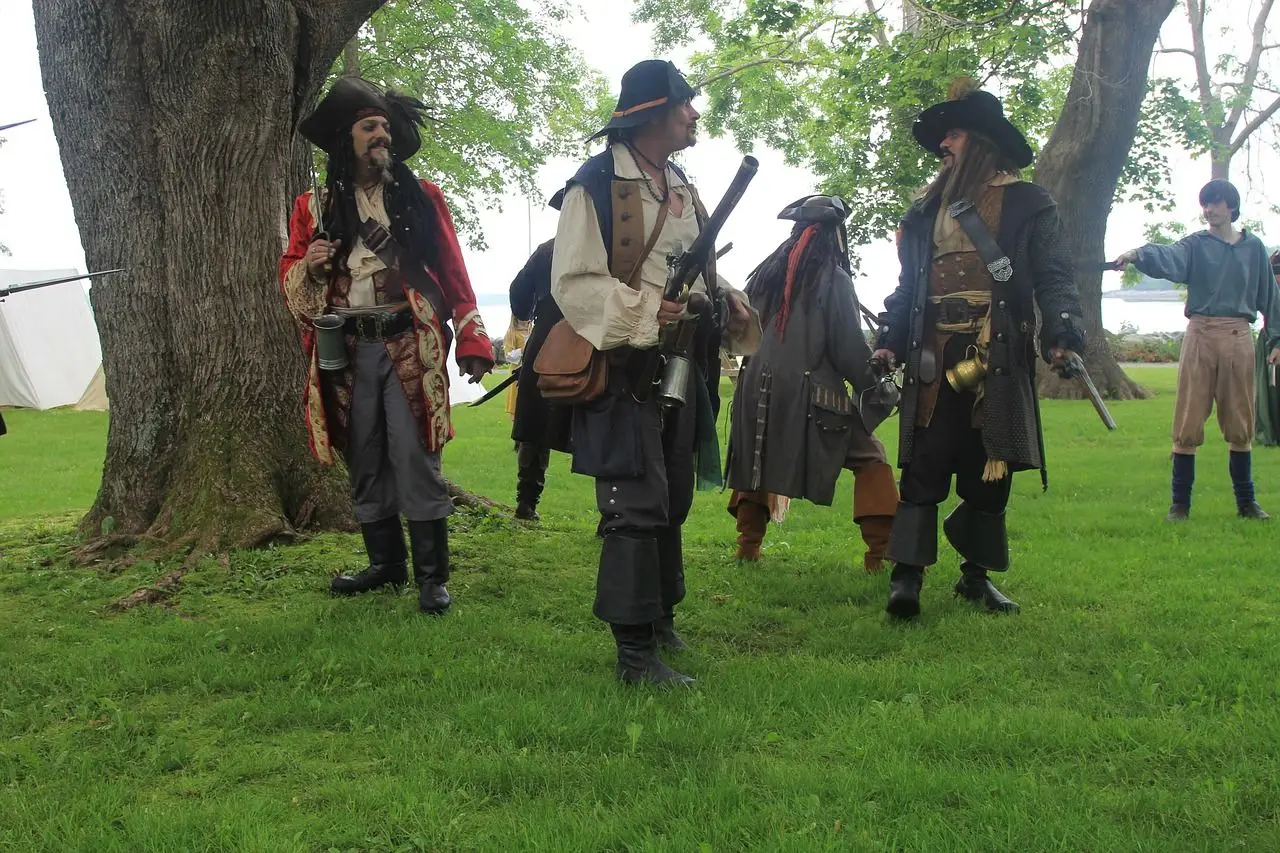 A group of people wearing pirate costume.