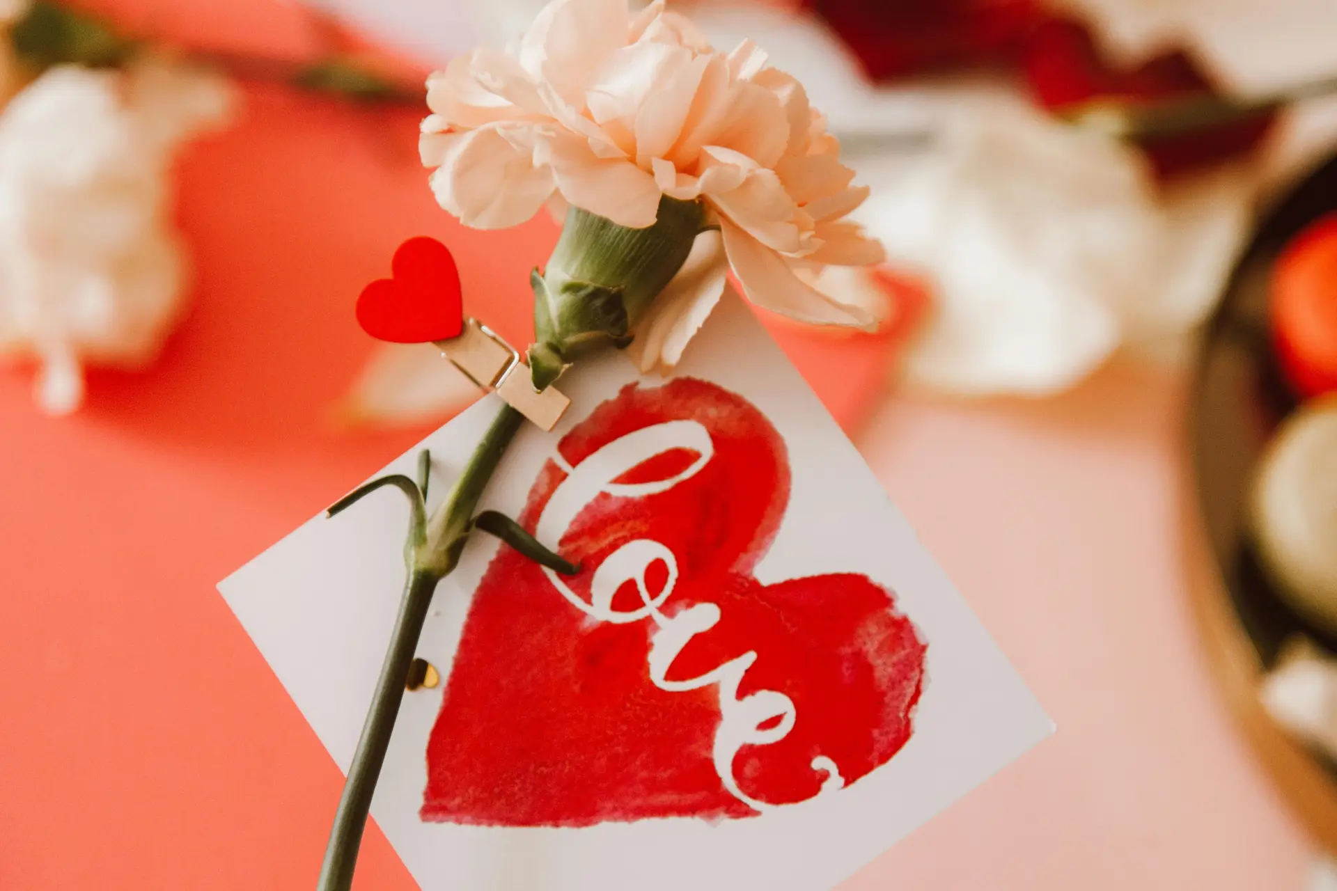 A Flower with a card. On it the word