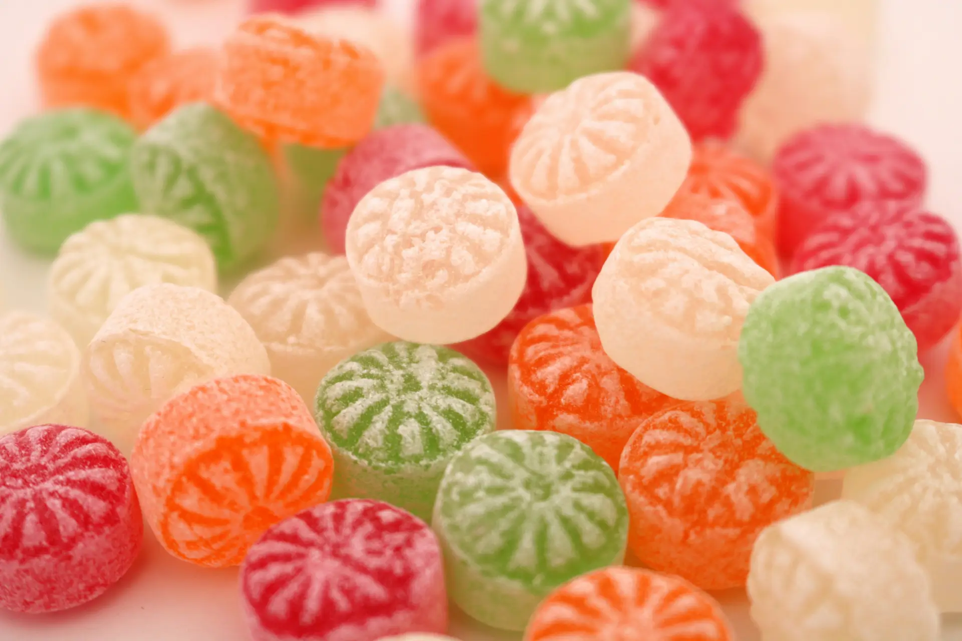 A pile of colorful candies sitting on top of a table.