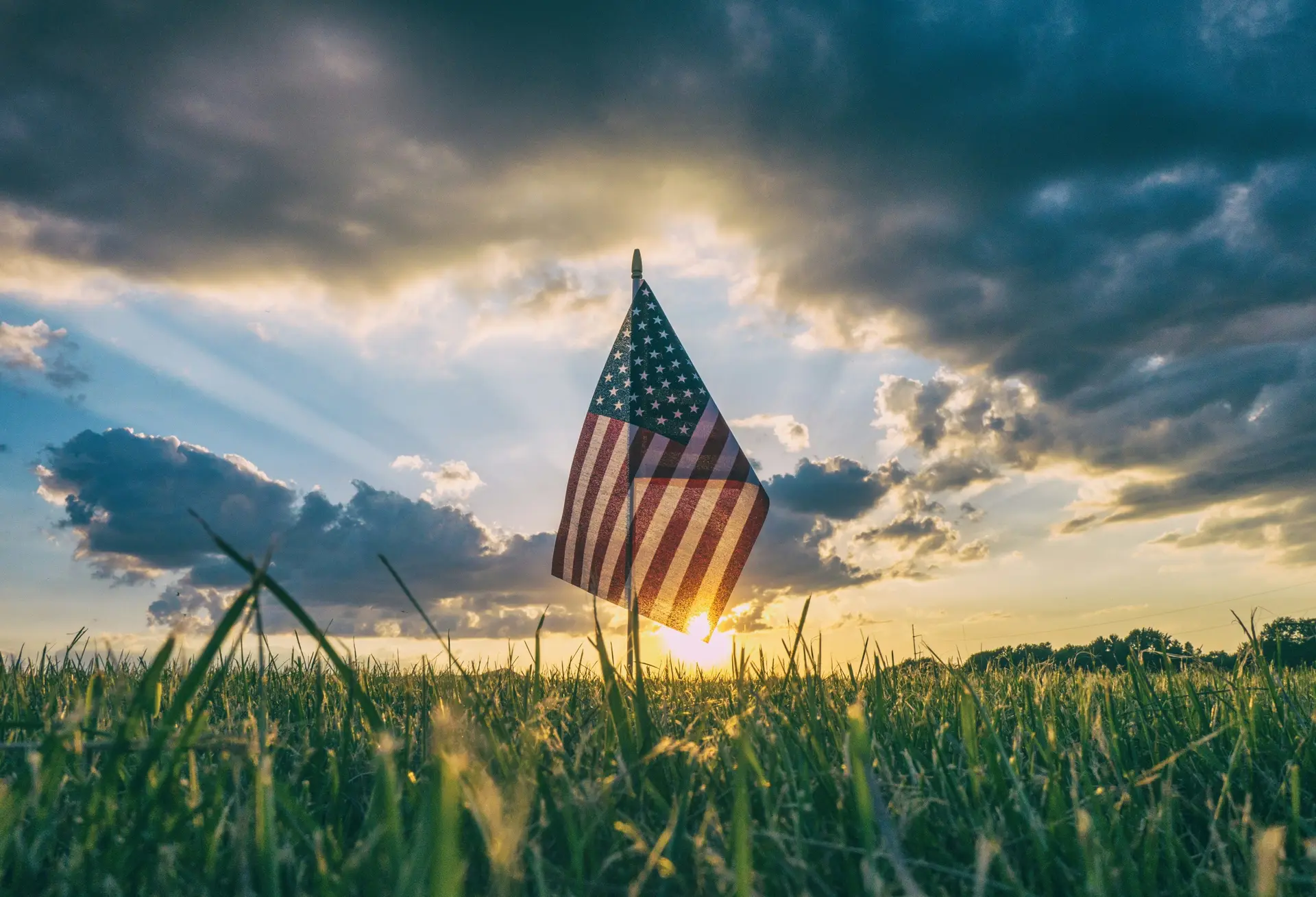 American flag in a grass field.