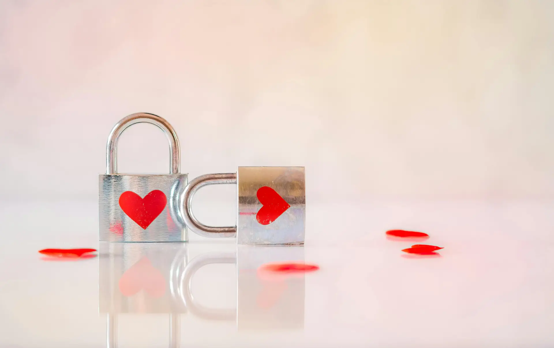 Two locks with heart shape decor on them