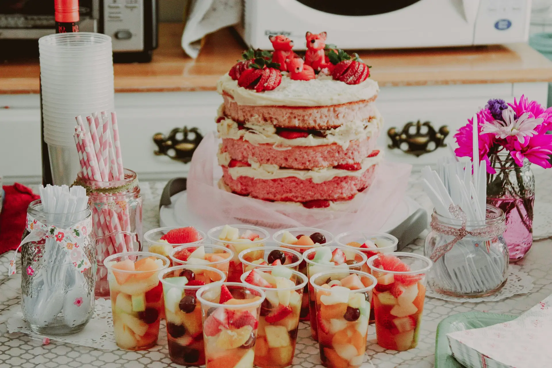 Sponge cake with blueberry jam in between and topped with blueberries.