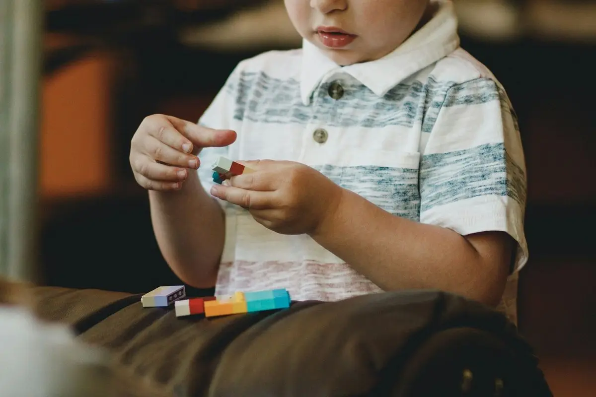Boy-holding-toy.jpg