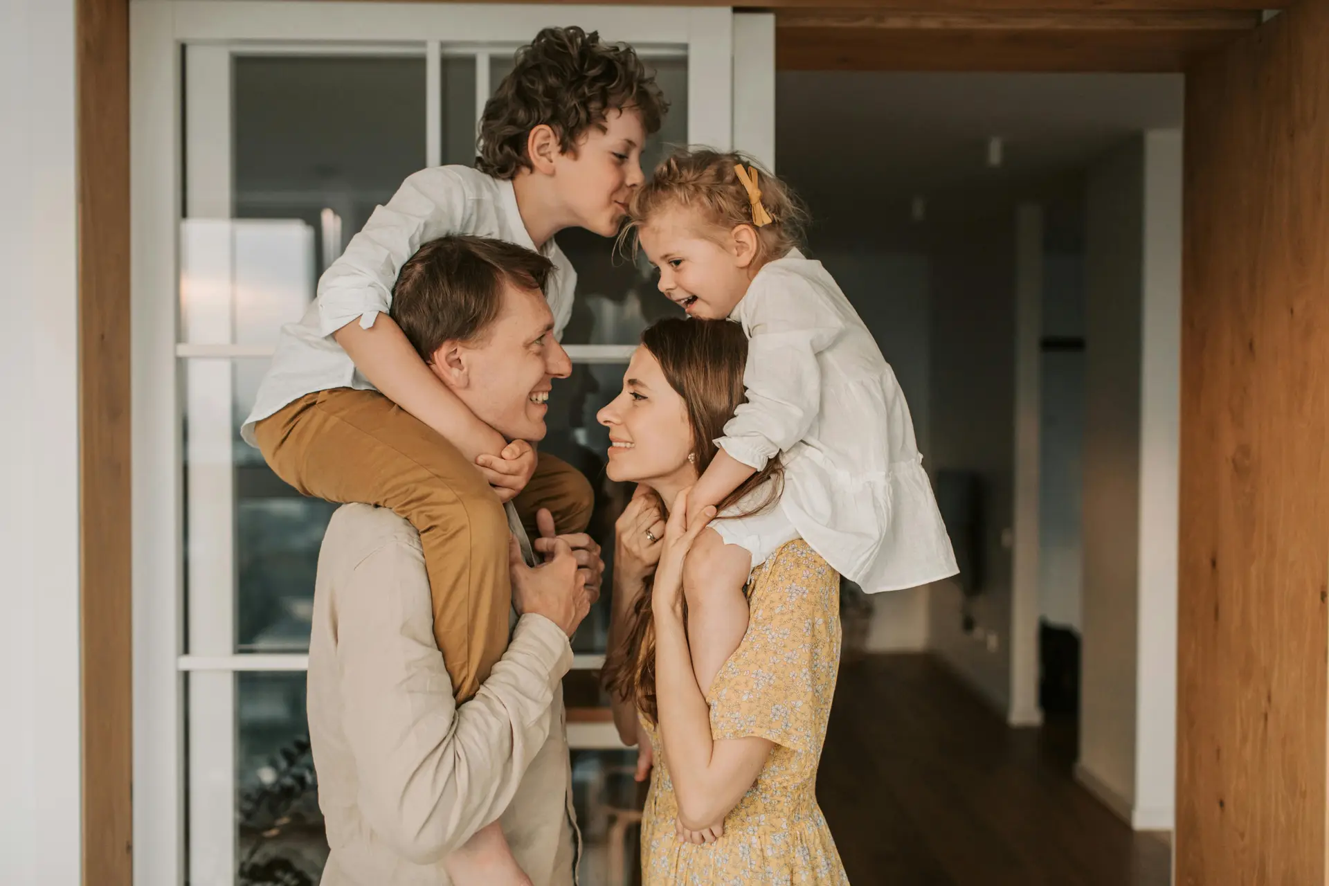 A mother and father spending quality time together with their son and daughter.