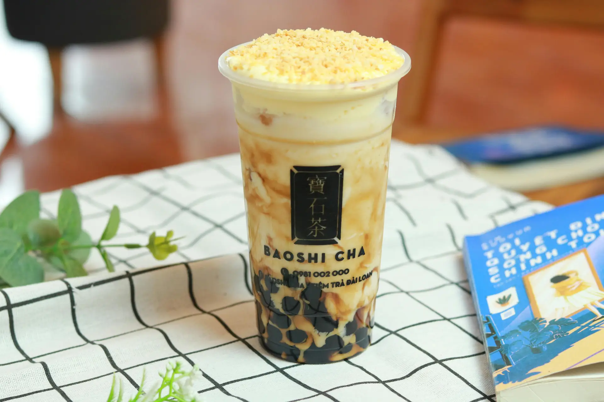 A tapioca drink on a table. The cup has