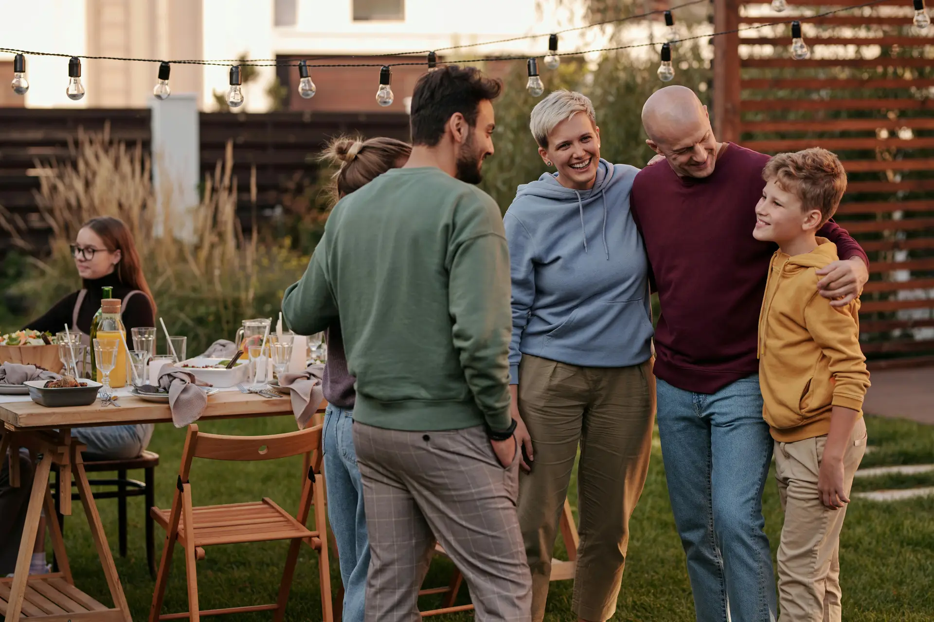 Two families of neighbors meeting each other in a party.