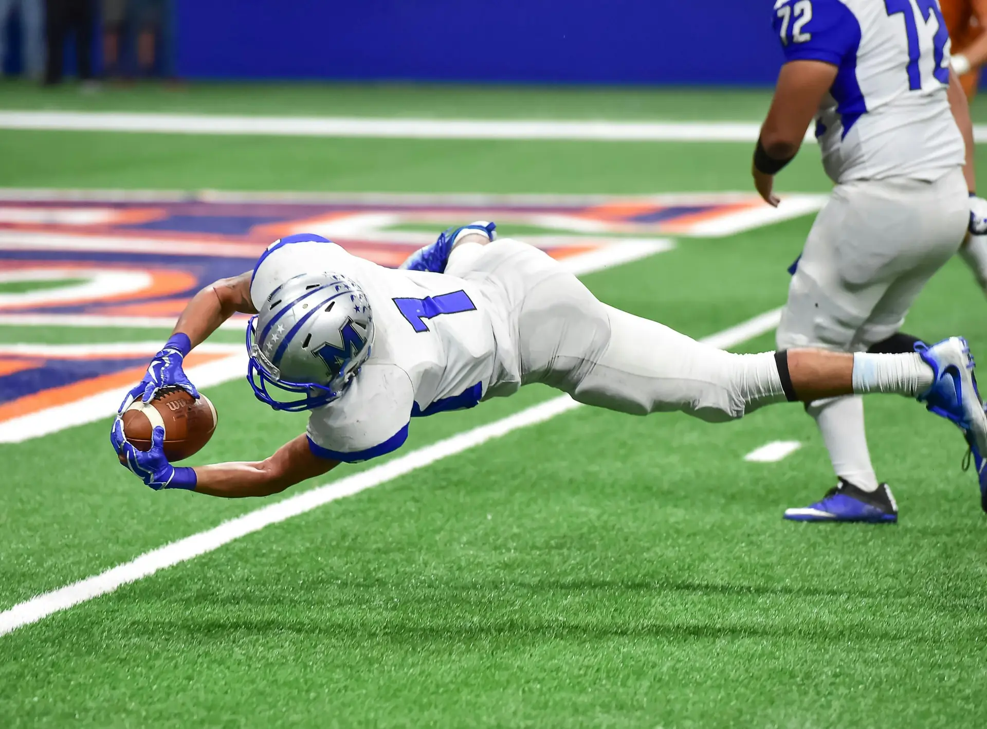 Football Players going for a touchdown