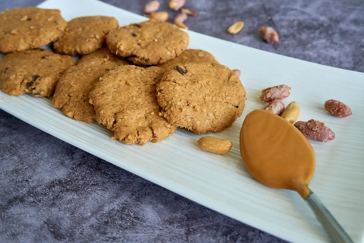 Tasty peanut butter cookies arranged on a white plate.