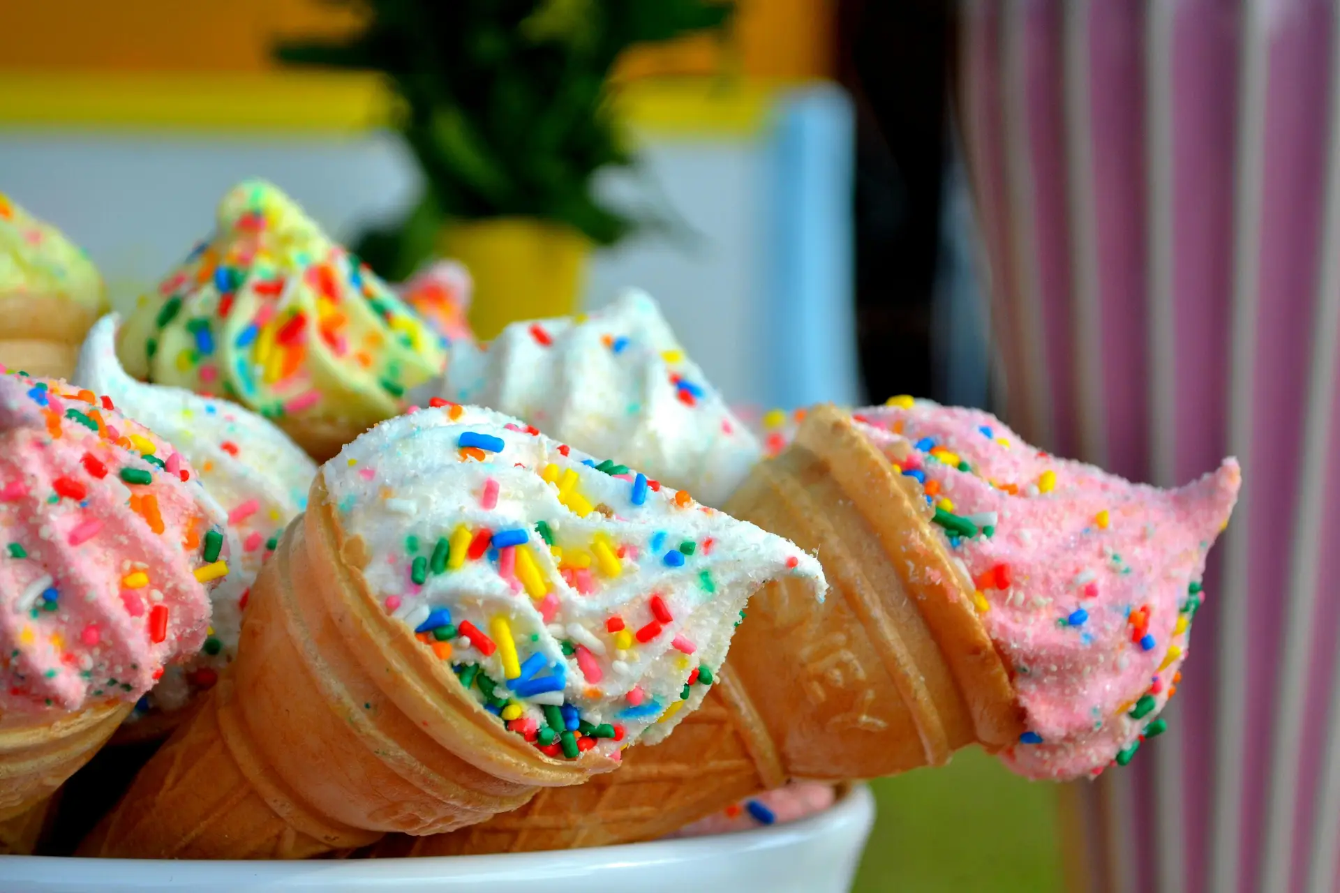An assortment of ice creams of different flavors with different toppings.