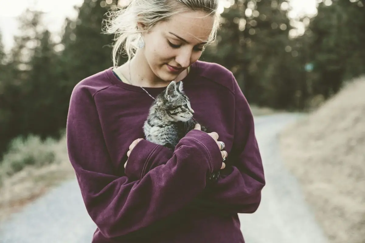 a-woman-hugging-cat.jpg