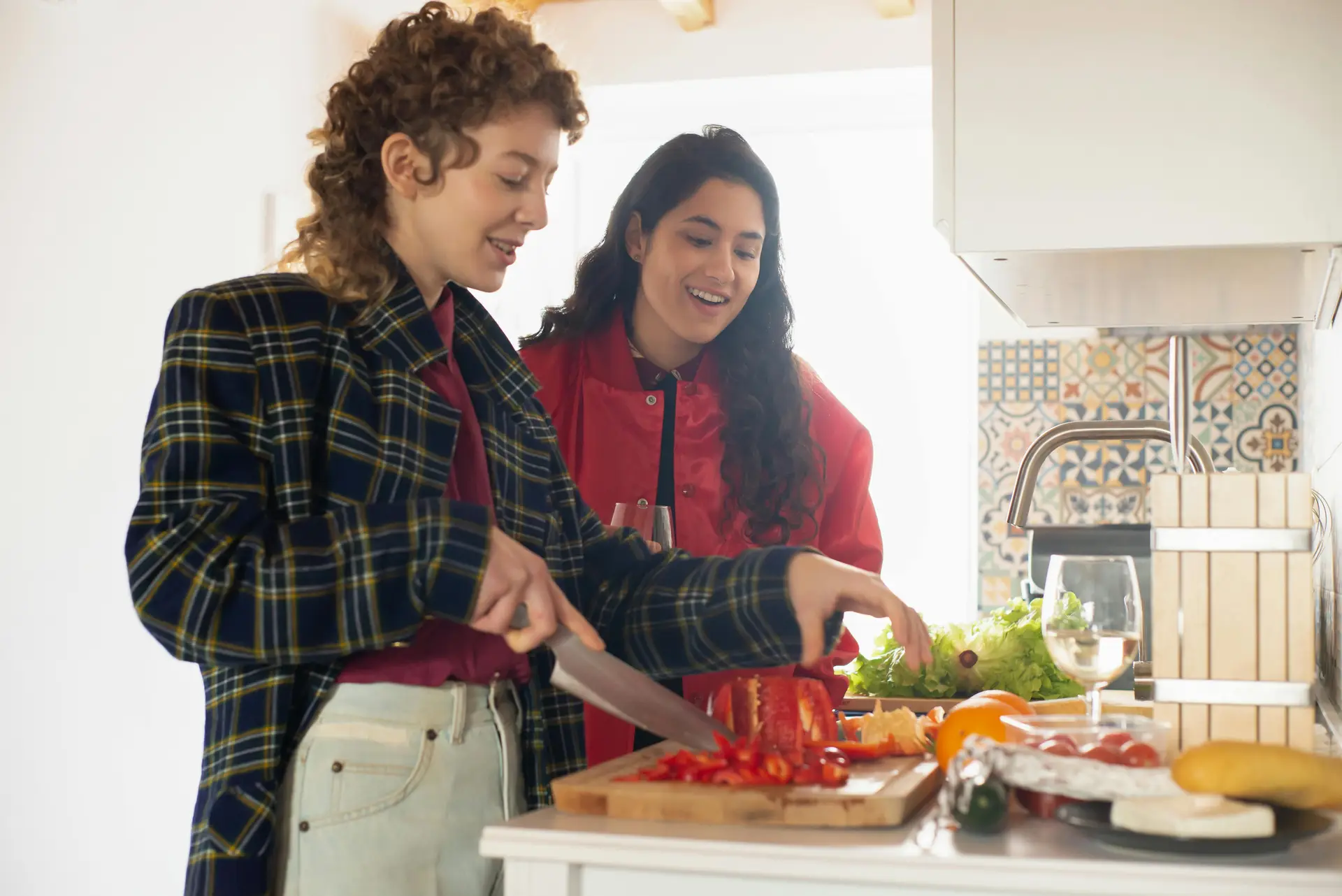 Two women cooking together and having fun.