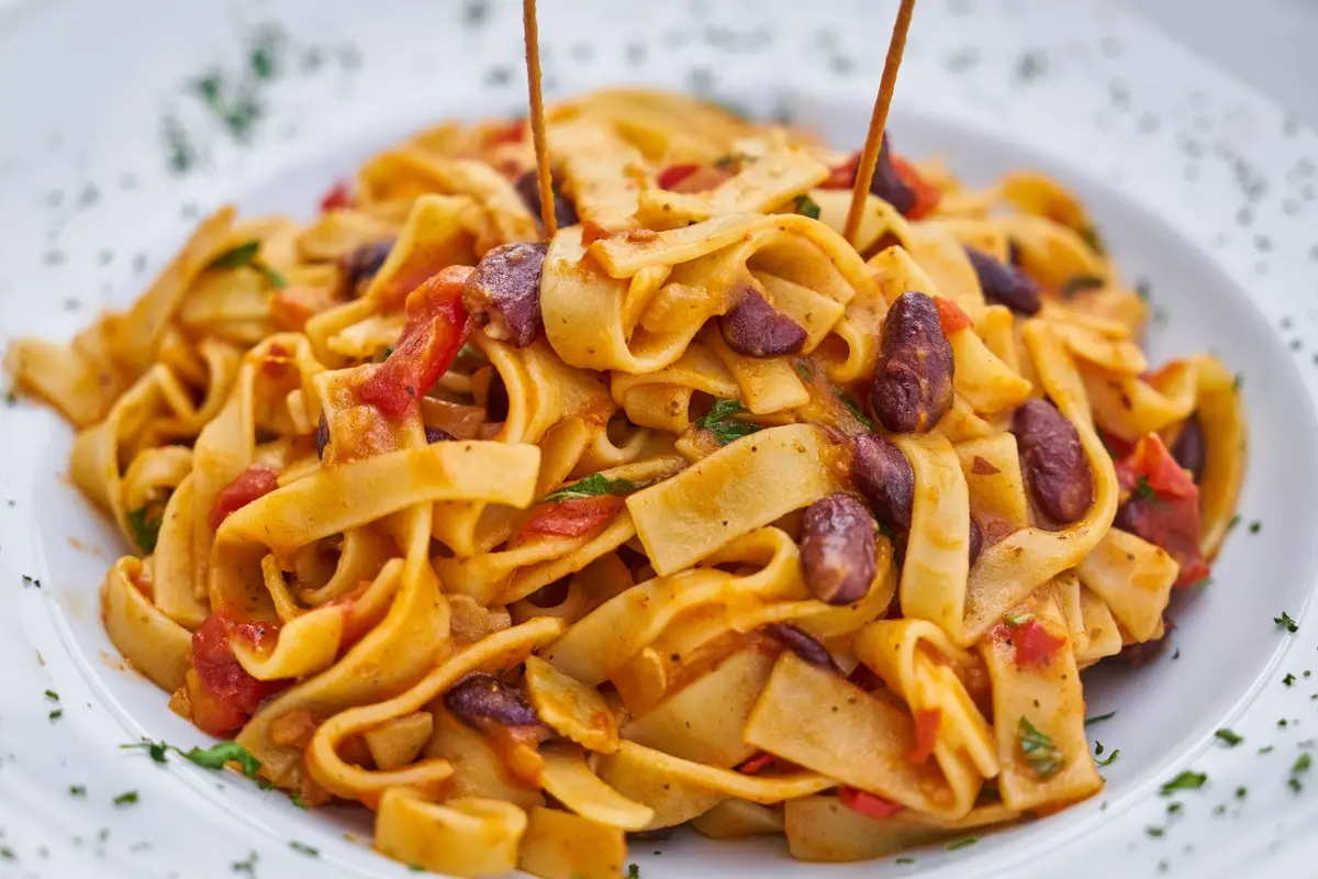 Delicious Italian pasta dish with kidney beans and rich sauce.