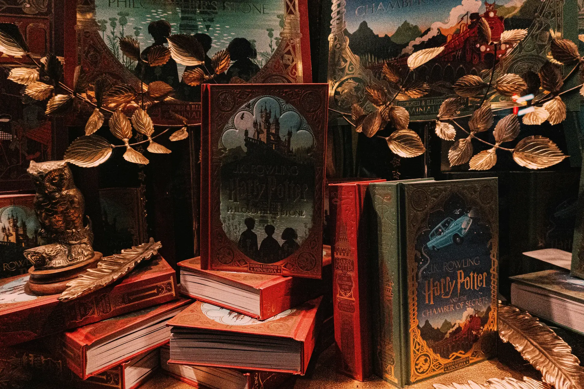 Harry Potter books on red and brown wooden shelf.