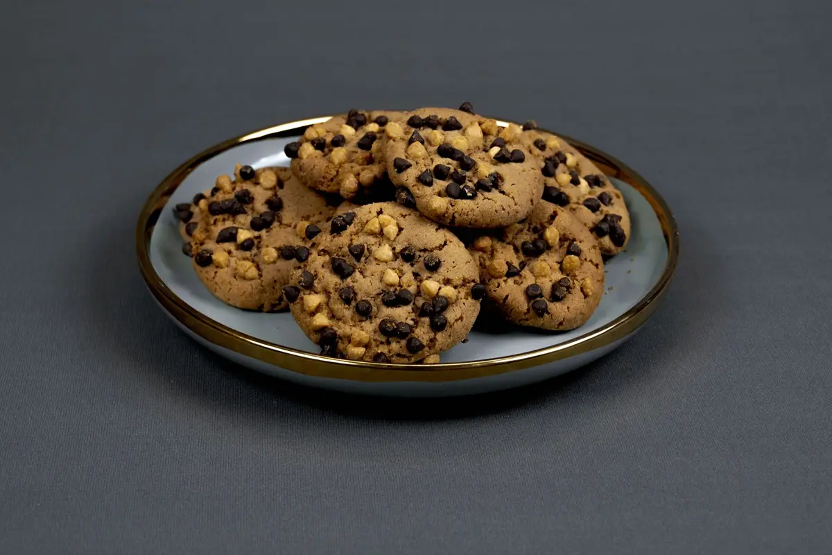 A plate of delicious chocolate chip cookies, perfect for snack time or dessert.