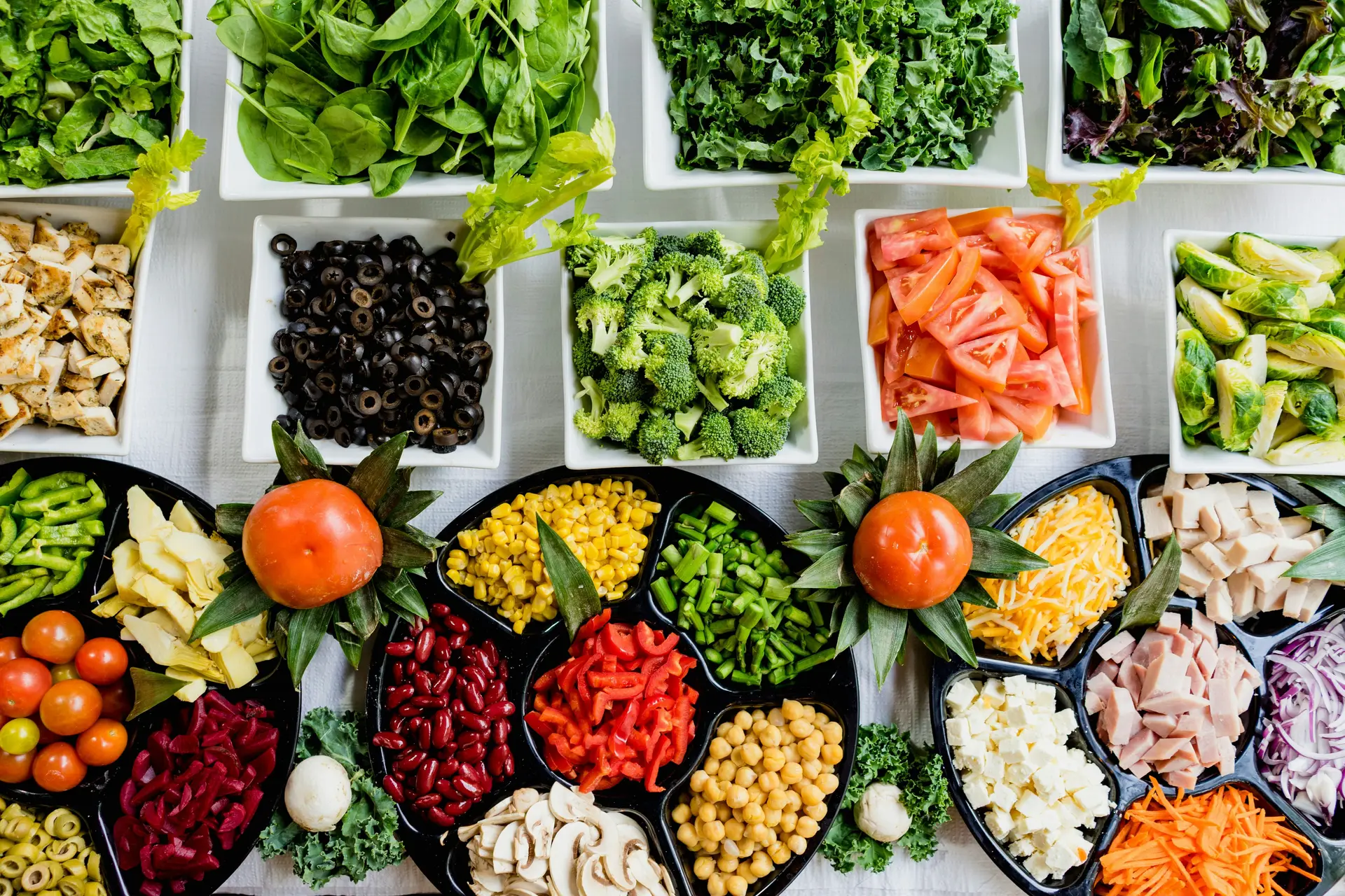 An assortment of vegetables in different bowls.