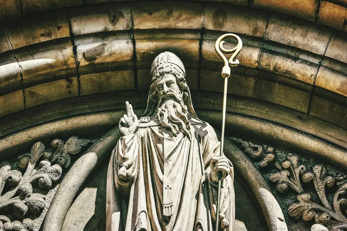 A statue of Saint Patrick blessing.