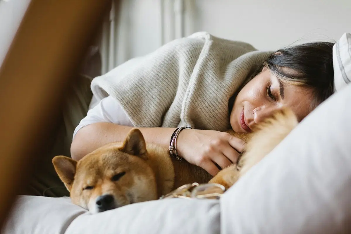 person-sleeping-with-dog.jpg