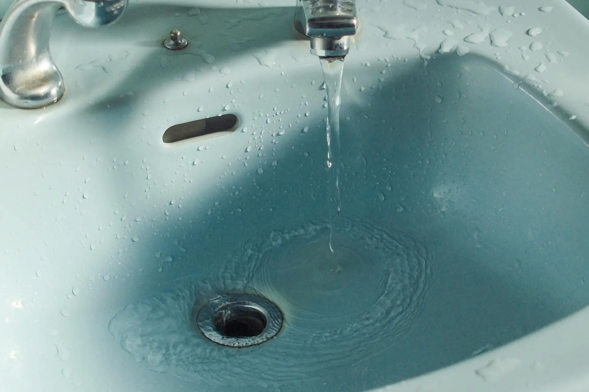 Water wasted from a tap in a sink