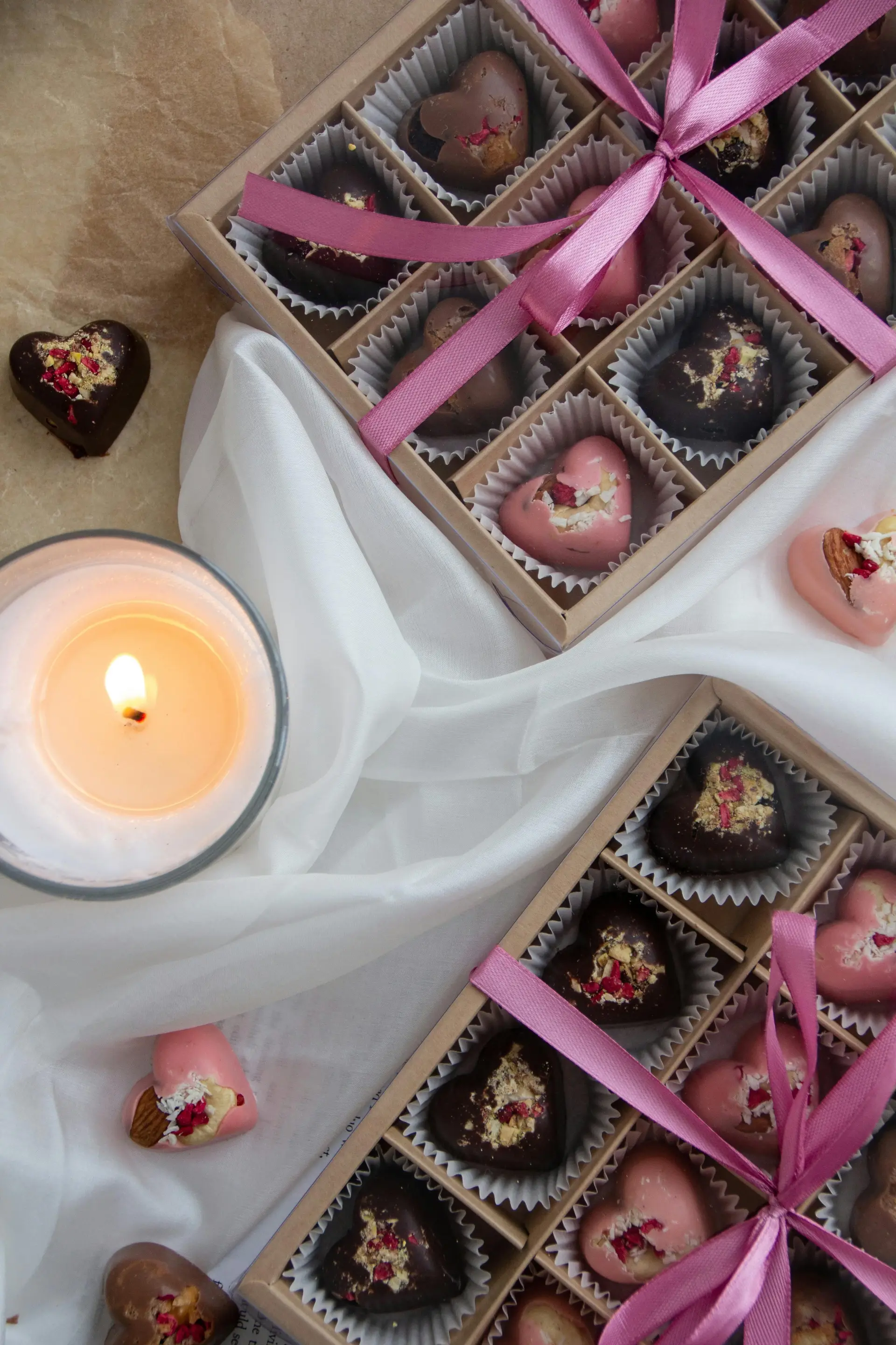 A rectangular box created with individual heart shaped chocolates kept in each grid box