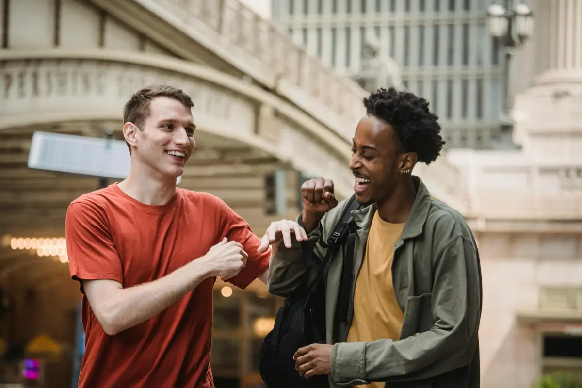 Two friends enjoying a fun and carefree day in the city, sharing laughter and smiles.